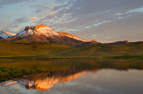 Ear Mountain reflcts into calm Lake Theboe along the Rocky Mountain Front in Montana